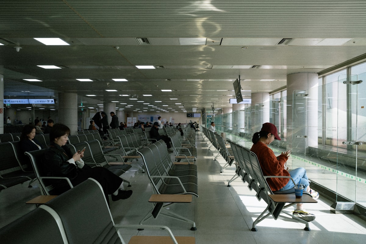 Traveler placing a call from an airport lounge